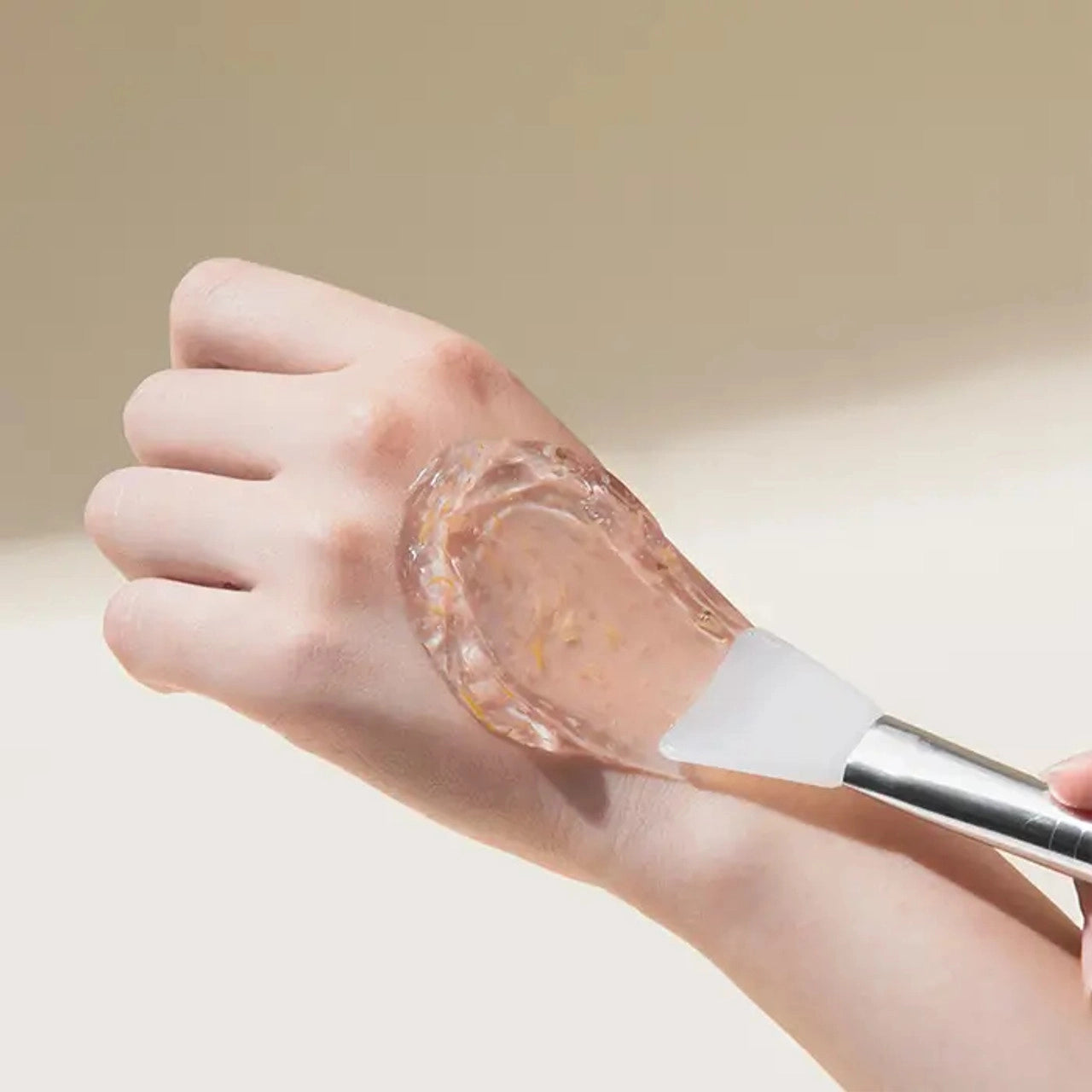 Woman applying Mary & May Calendula Peptide Ageless Sleeping Mask to her face