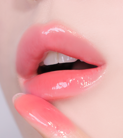 Swatch of HUEMI Melting Glaze Lip Gloss 04 Flare Pink on arm